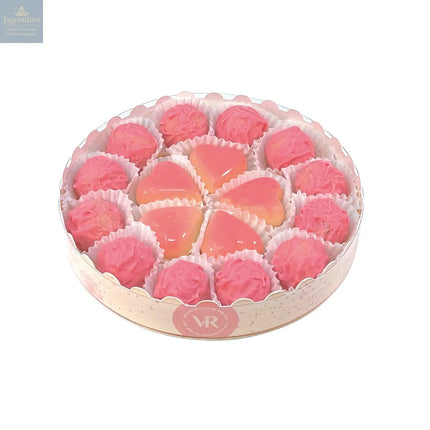 16cm round gift box of Marc de Champagne truffles and caramel filled blushed hearts