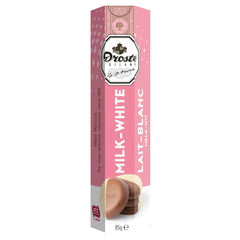 Milk and white chocolate pastilles in tube